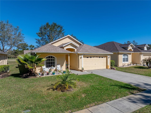 view of front of house with a garage and a front yard