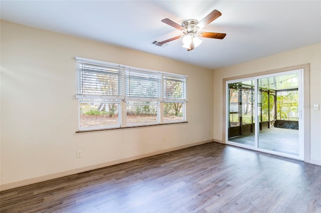 unfurnished room featuring hardwood / wood-style flooring and ceiling fan