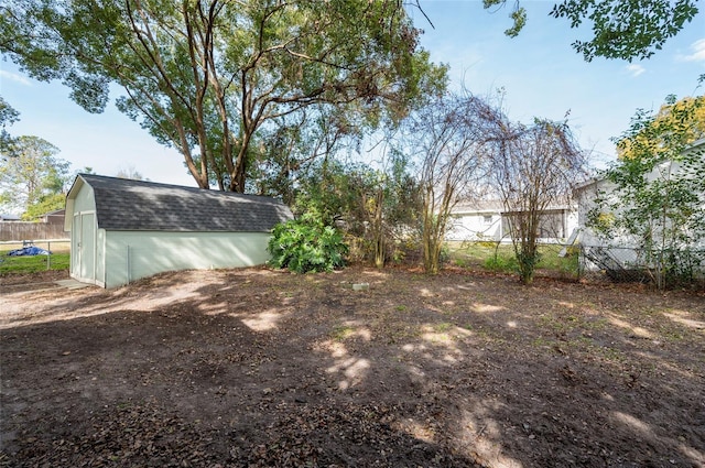 view of yard with a storage unit