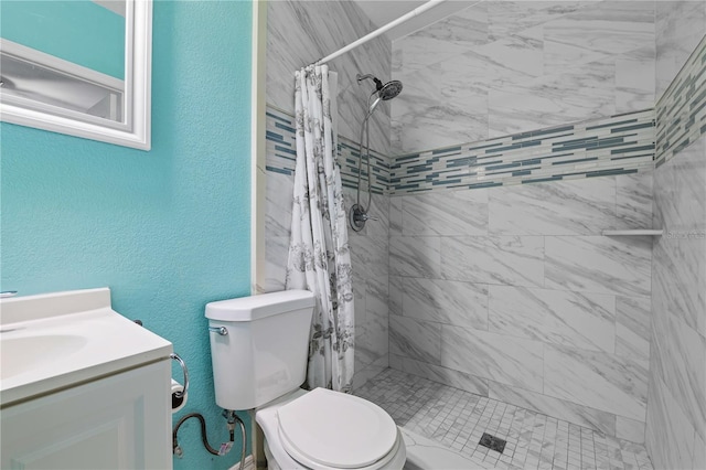 bathroom with a shower with curtain, vanity, and toilet