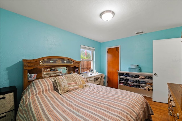 bedroom featuring light wood-type flooring