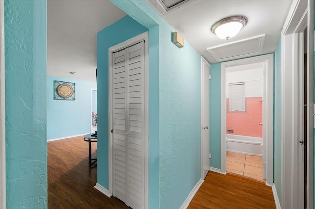 corridor featuring dark hardwood / wood-style flooring