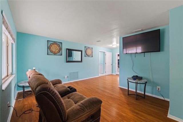 living room with hardwood / wood-style flooring