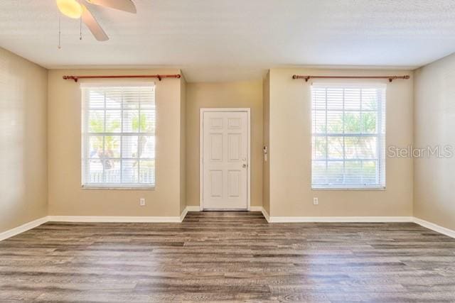 unfurnished room featuring hardwood / wood-style flooring and ceiling fan