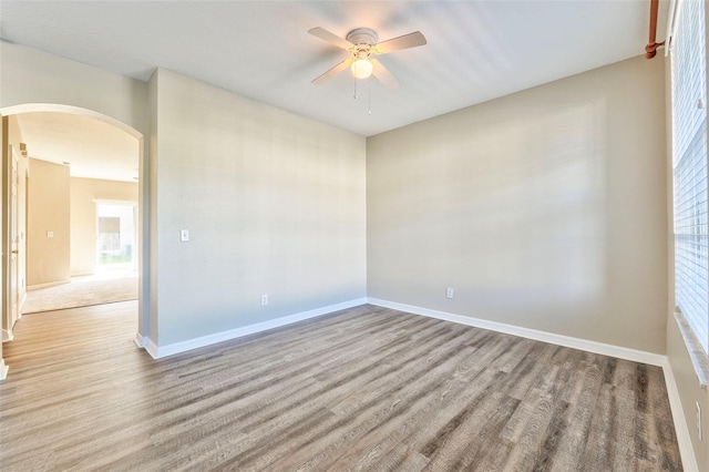 spare room featuring ceiling fan and light wood-type flooring