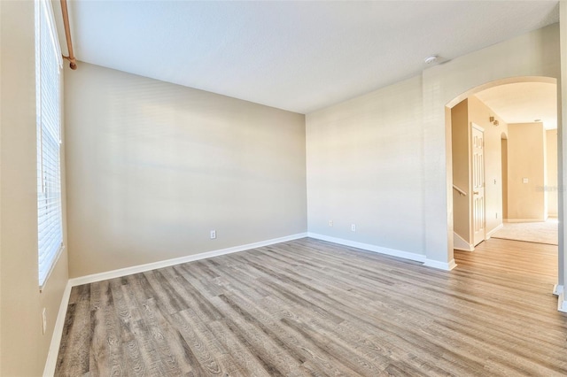 unfurnished room featuring light wood-type flooring