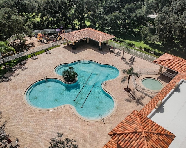 view of pool with a gazebo, a community hot tub, and a patio