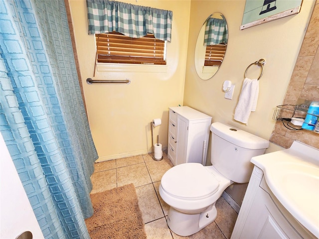 bathroom featuring vanity, curtained shower, tile patterned floors, and toilet