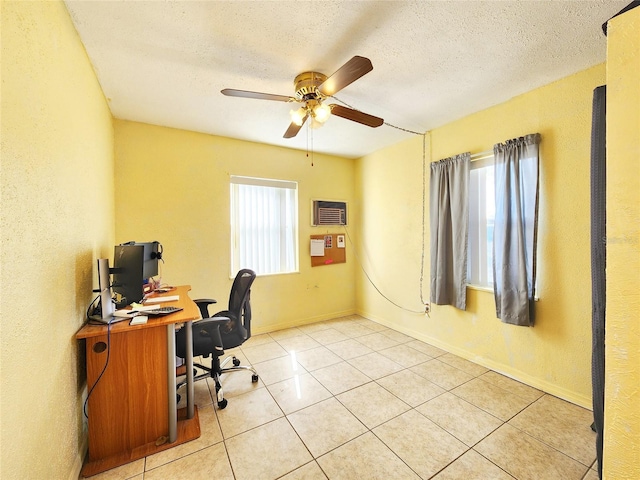 office featuring ceiling fan, a textured ceiling, and light tile patterned floors