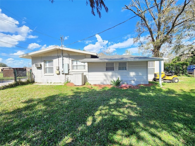 rear view of house with a yard