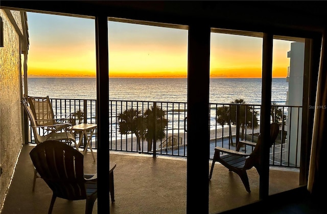 balcony at dusk with a water view