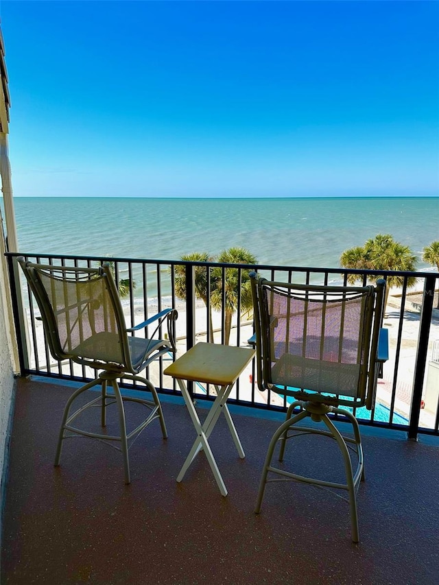 balcony featuring a water view