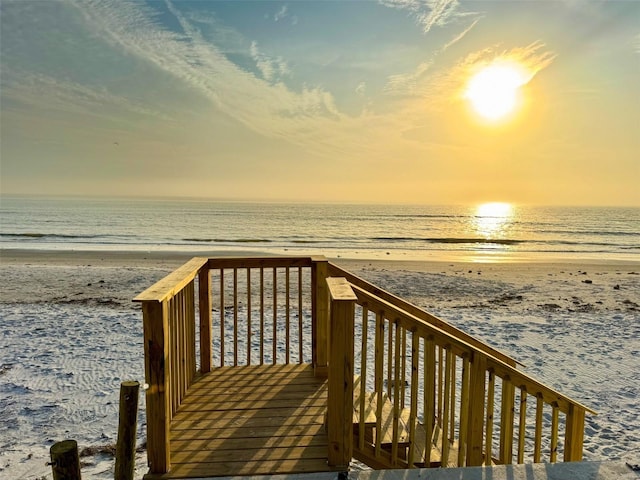 view of property's community featuring a beach view and a water view