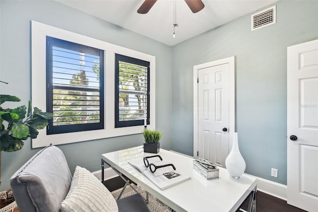 office space featuring dark wood-type flooring and ceiling fan