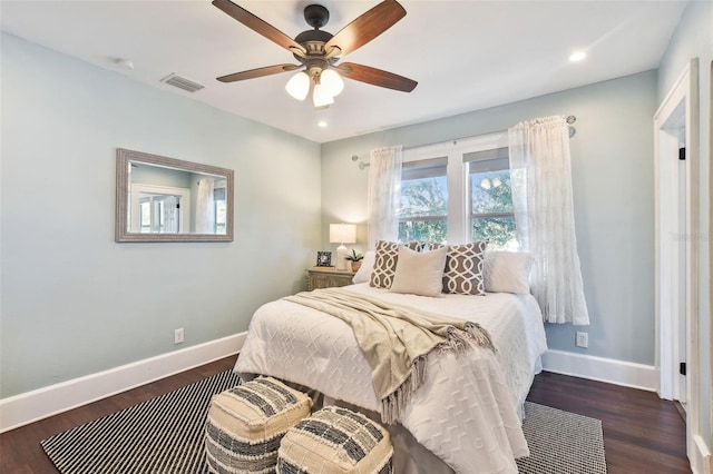 bedroom featuring dark hardwood / wood-style floors and ceiling fan