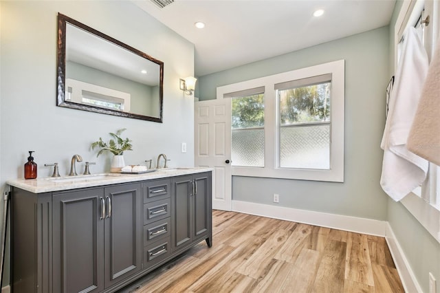 bathroom featuring hardwood / wood-style flooring and vanity