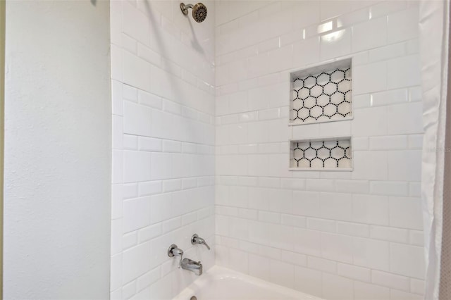 bathroom with shower / bath combination with curtain