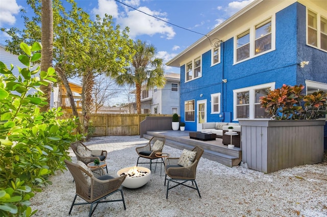 view of patio featuring an outdoor living space with a fire pit