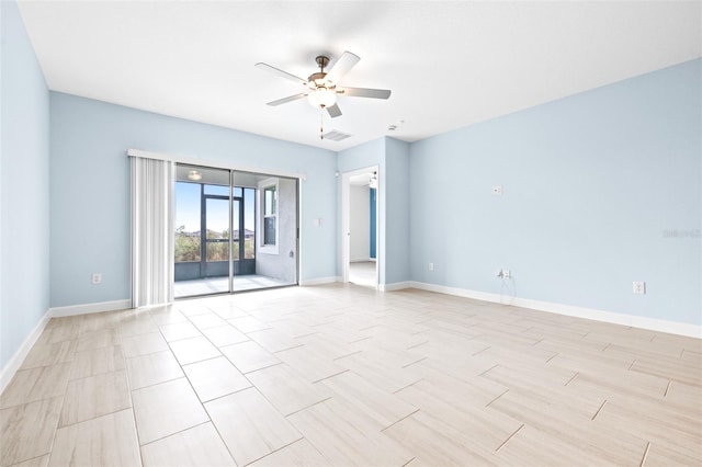 empty room featuring ceiling fan and light wood-type flooring