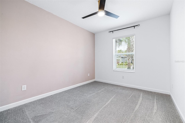 unfurnished room featuring carpet floors and ceiling fan