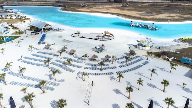 aerial view featuring a water view and a beach view