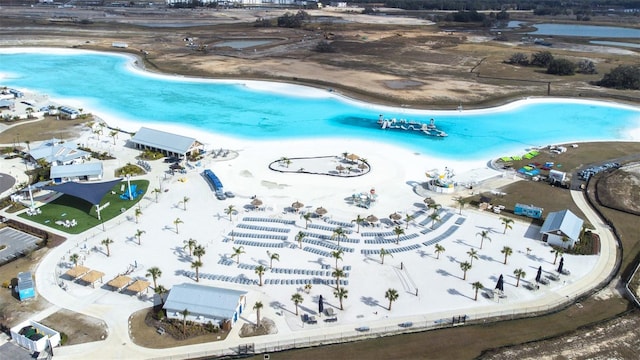 aerial view featuring a water view and a beach view