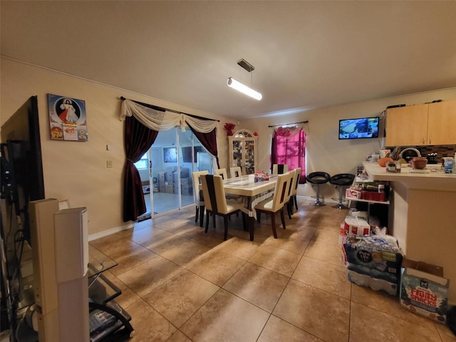 dining space with light tile patterned floors