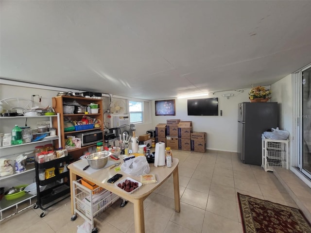 dining space featuring light tile patterned floors