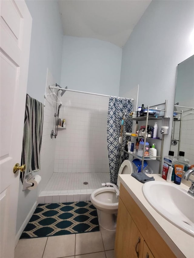 bathroom with tile patterned floors, toilet, a shower with curtain, vaulted ceiling, and vanity