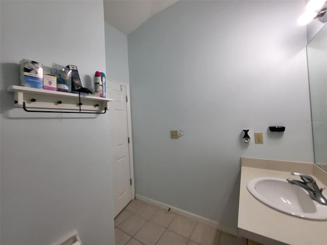 bathroom featuring tile patterned flooring and vanity