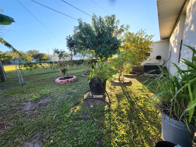 view of yard featuring central air condition unit