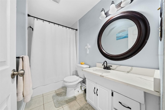 bathroom with vanity, tile patterned floors, and toilet