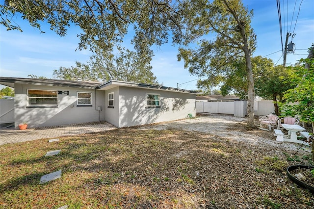 rear view of property featuring a patio