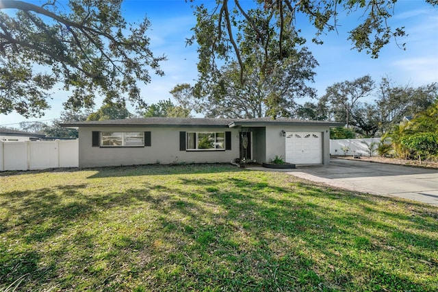 single story home with a garage and a front yard