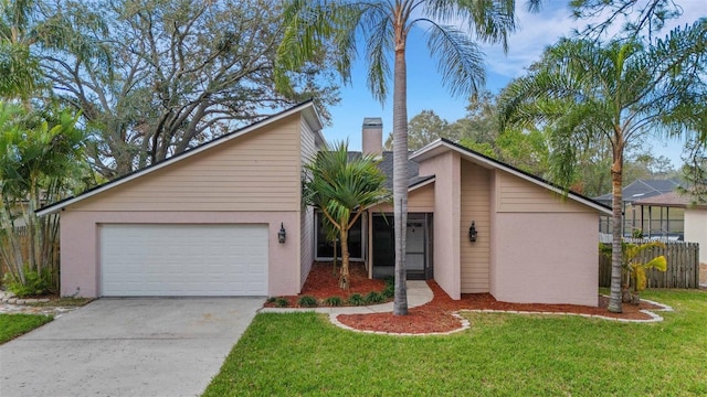 ranch-style house with a garage and a front lawn