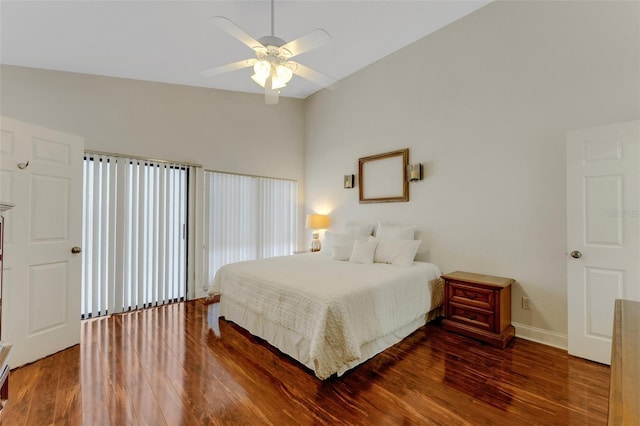 bedroom with dark hardwood / wood-style floors and ceiling fan