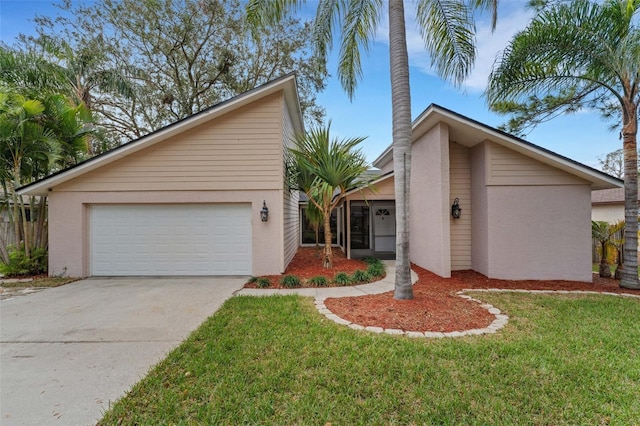 ranch-style house with a garage and a front lawn