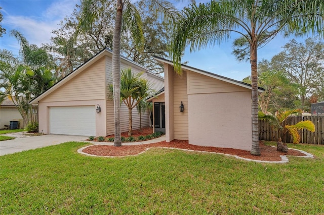 ranch-style house with a garage and a front yard