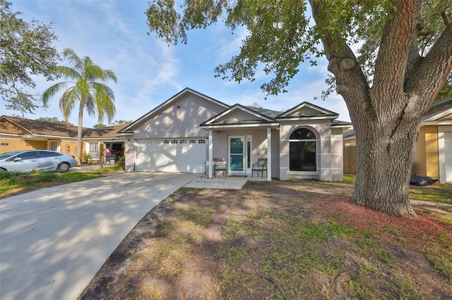 ranch-style house featuring a garage