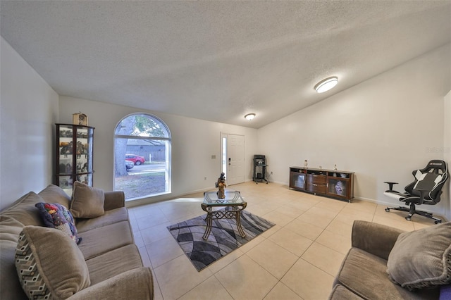 tiled living room with lofted ceiling and a textured ceiling