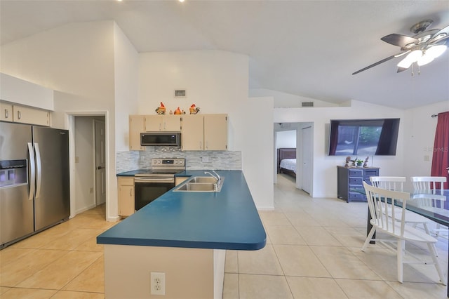 kitchen featuring sink, light tile patterned floors, stainless steel appliances, and decorative backsplash