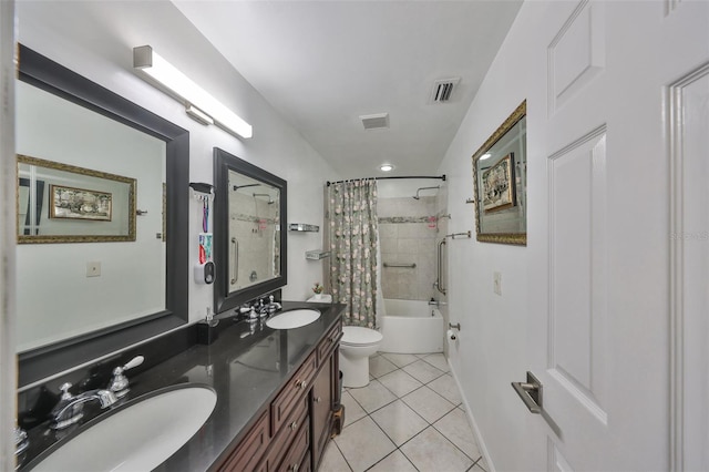 full bathroom with tile patterned floors, toilet, shower / tub combo, and vanity