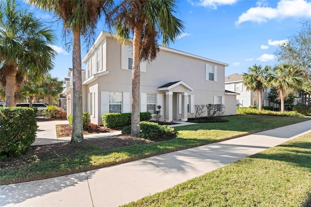 view of front of home with a front lawn