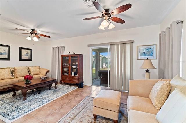 living room featuring light tile patterned floors and ceiling fan