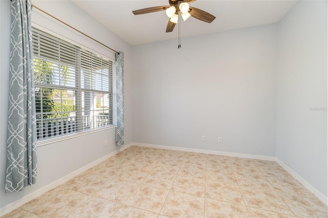 tiled empty room with ceiling fan