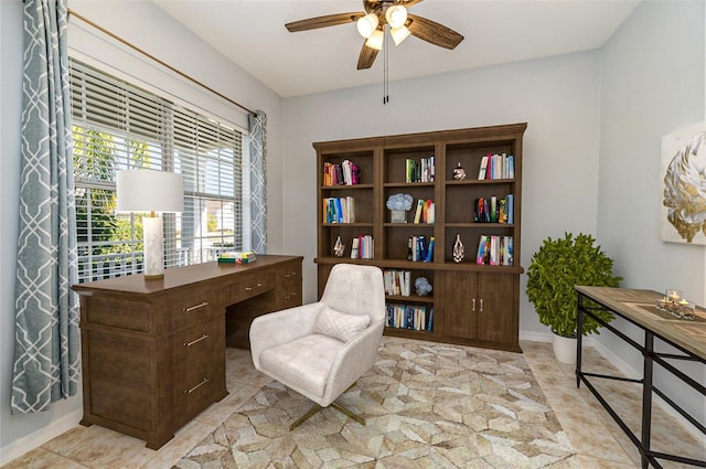 living area with ceiling fan