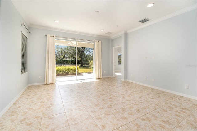 tiled spare room featuring ornamental molding