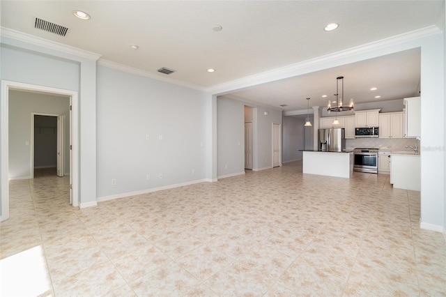 unfurnished living room with a notable chandelier, ornamental molding, and light tile patterned flooring