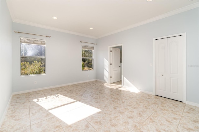 tiled empty room featuring crown molding