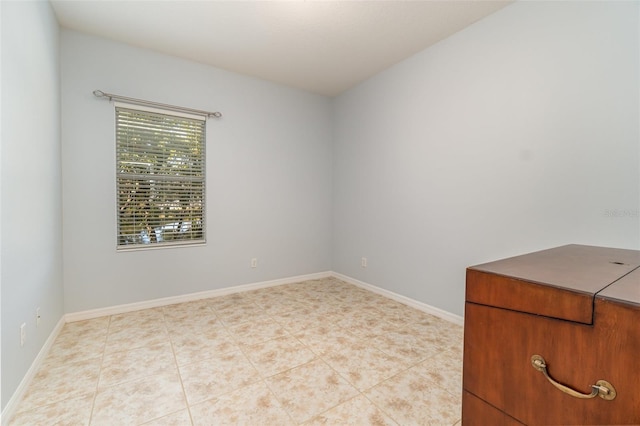 empty room with light tile patterned floors